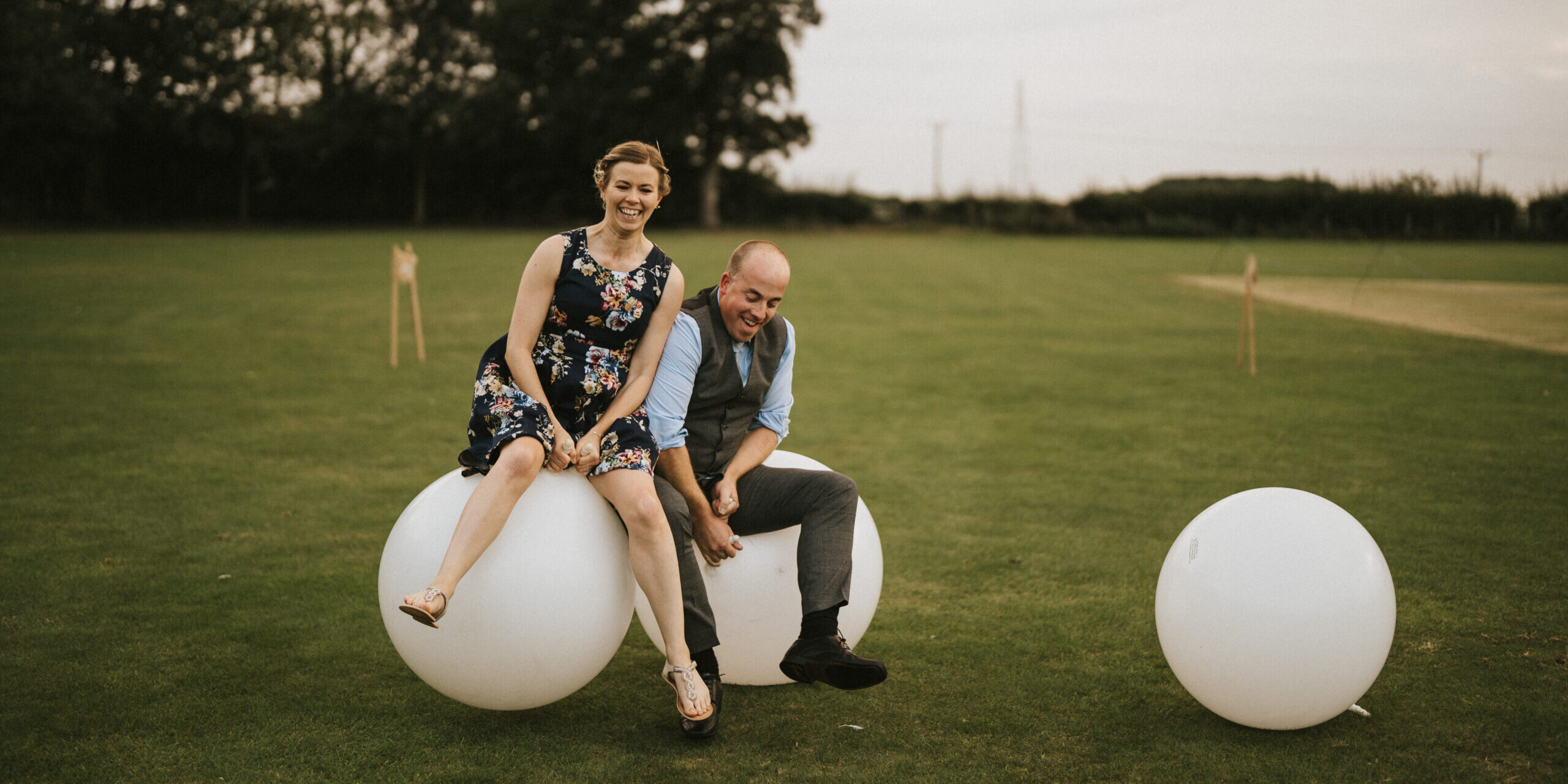 Emma and Mark from Emma Lane Designs Game Hire bouncing on Adult Sized white space hoppers having fun | Garden Game Hire in Derbyshire, Lincolnshire and Nottinghamshire