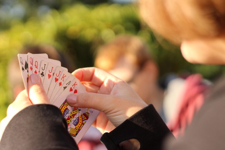 Holding a hand of playing cards | Card game ideas for couples