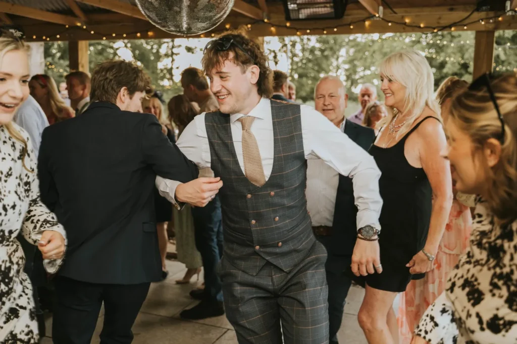 Wedding guests dancing together and having fun