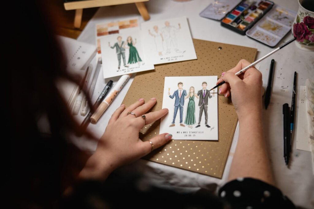 Live wedding illustrator Jam Illustrations at a wedding.