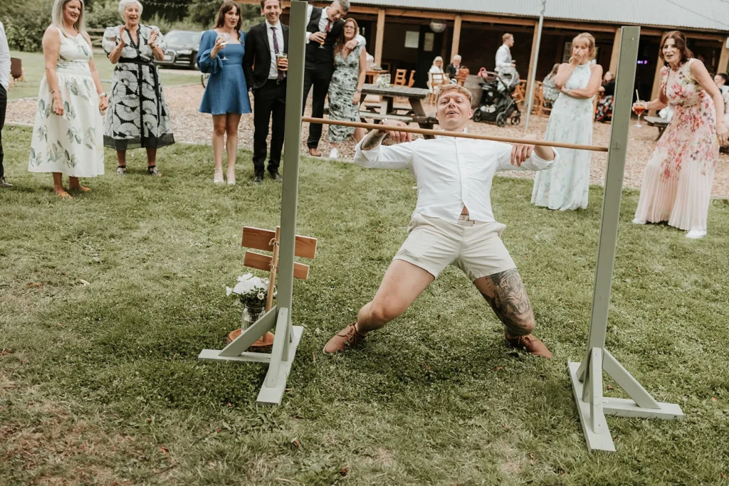 Guests having fun on wedding garden games. A fantastic wedding entertainment idea for adults