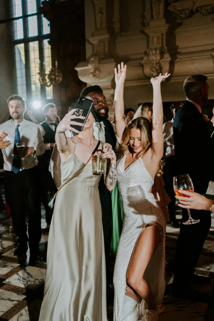 Wedding guests and the bride dancing the night away. Great music creates the best atmosphere at a wedding